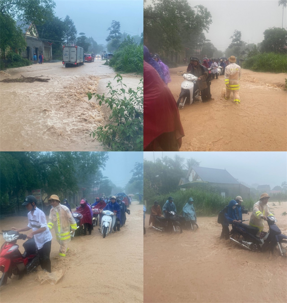 Lực lượng Cảnh sát giao thông hướng dẫn, hỗ trợ các em học sinh, người dân tham gia giao thông đi qua điểm ngập lụt trên tuyến đường 217B qua địa bàn huyện Thạch Thành.