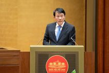 Minister Luong Tam Quang presents report on four draft laws to National Assembly